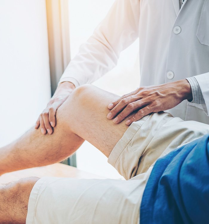 Physician performing non-surgical orthopedic treatment