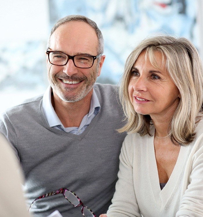 Older man and woman talking to orthobiologic medicine specialist