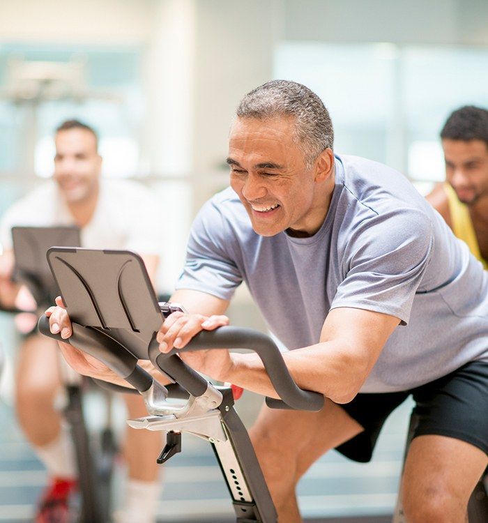 Man pain free at spin class after medical acupuncture