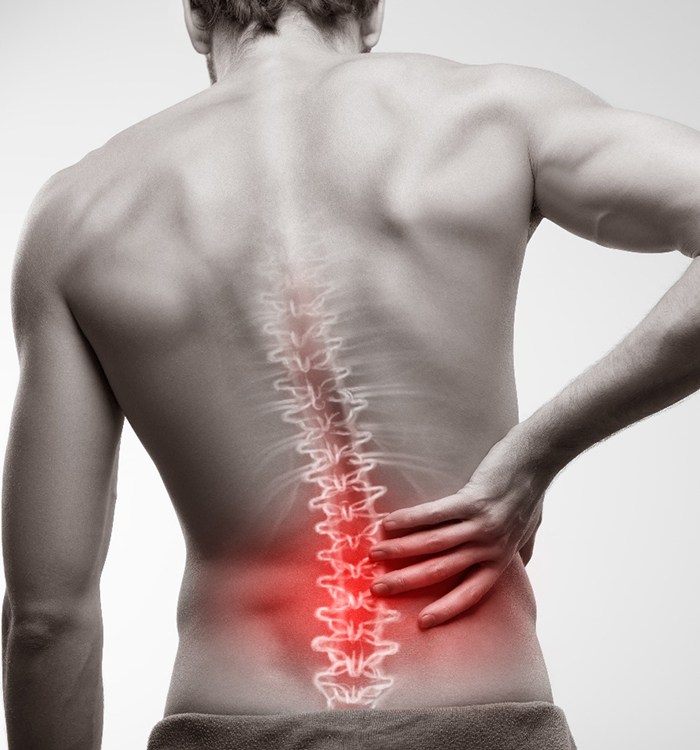 man holding back with spine being highlighted graphically 