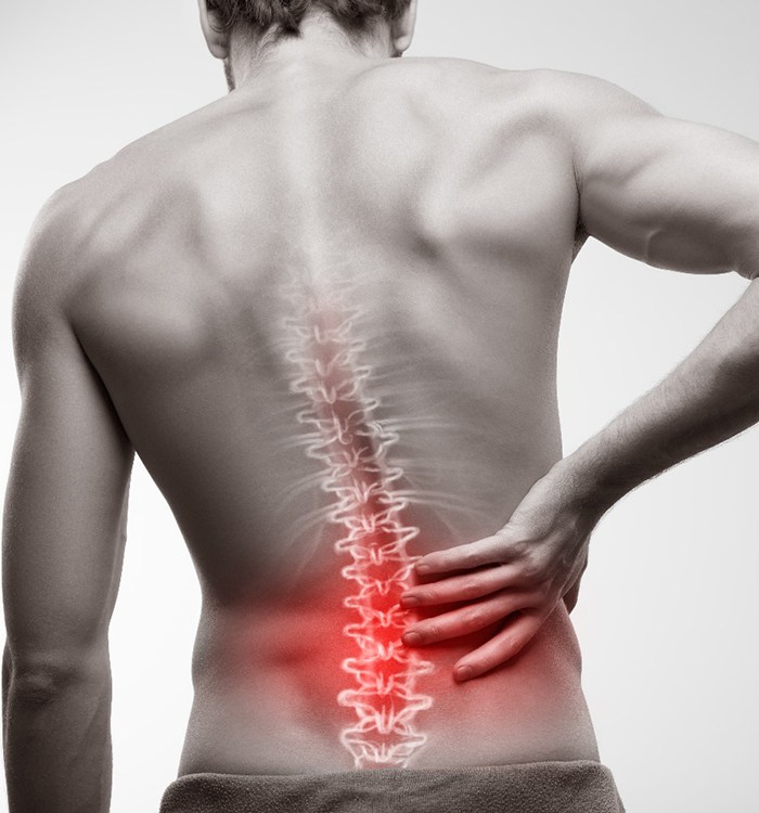 man holding back with spine being highlighted graphically