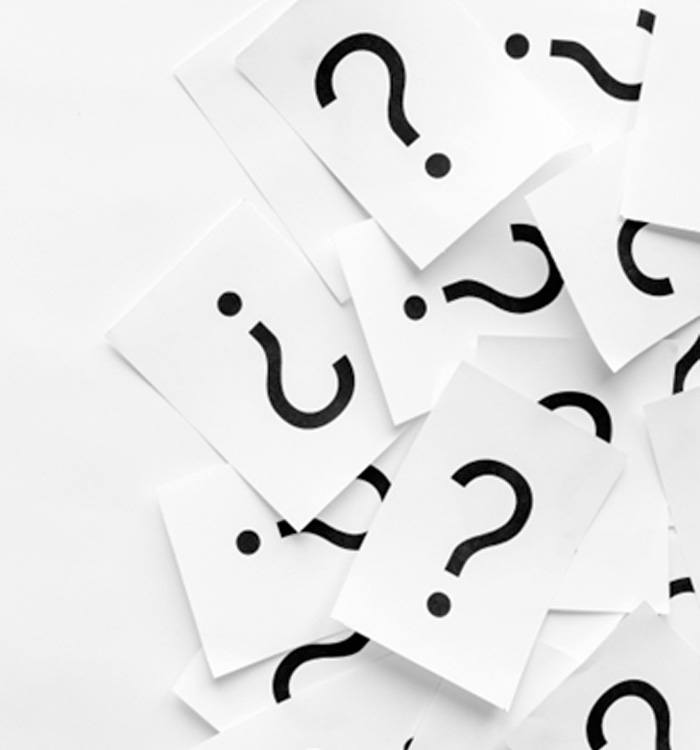Notecards with question marks against white background