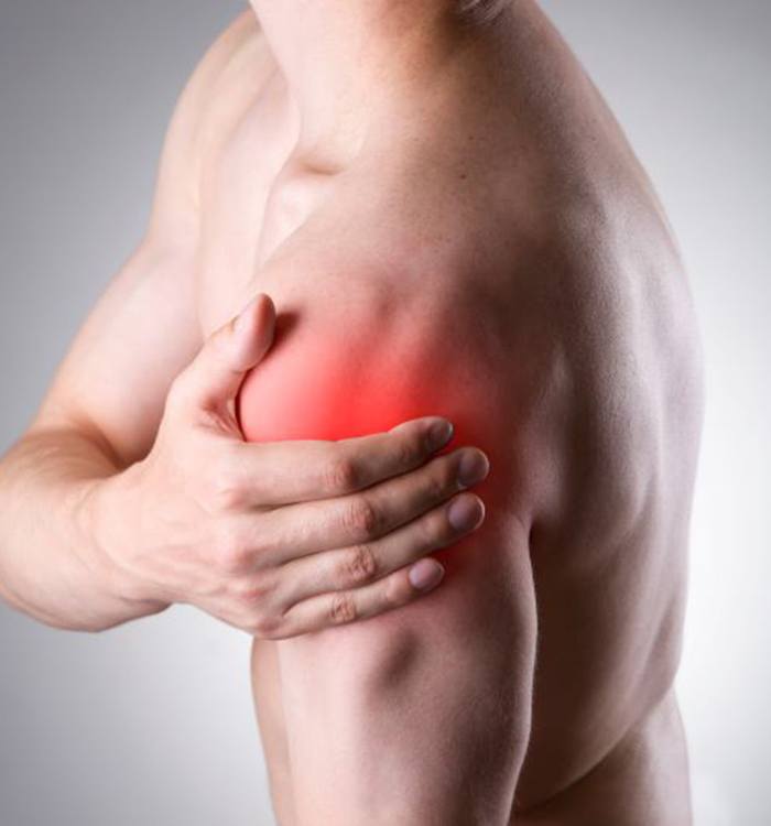 Man touching his painful shoulder