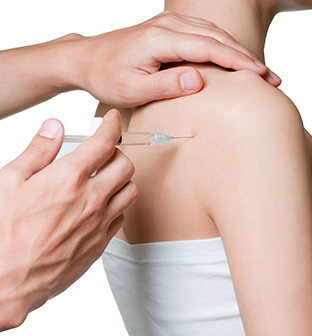 Physician placing corticosteroid injection in shoulder