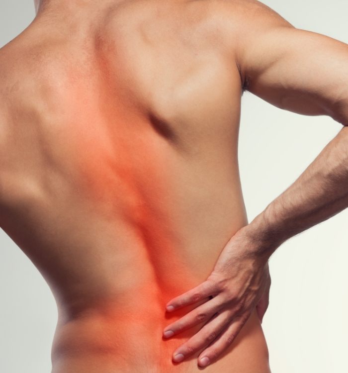 Patient with back pain in need of neuromusculoskeletal injections for pain relief