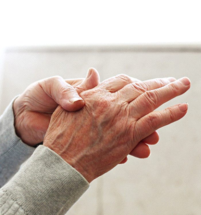 older man experiencing osteoarthritis in their hand