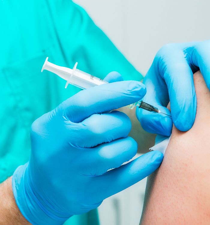 Medical professional administering injection for prolotherapy in Asheville