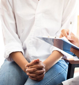 patient talking to doctor during consultation