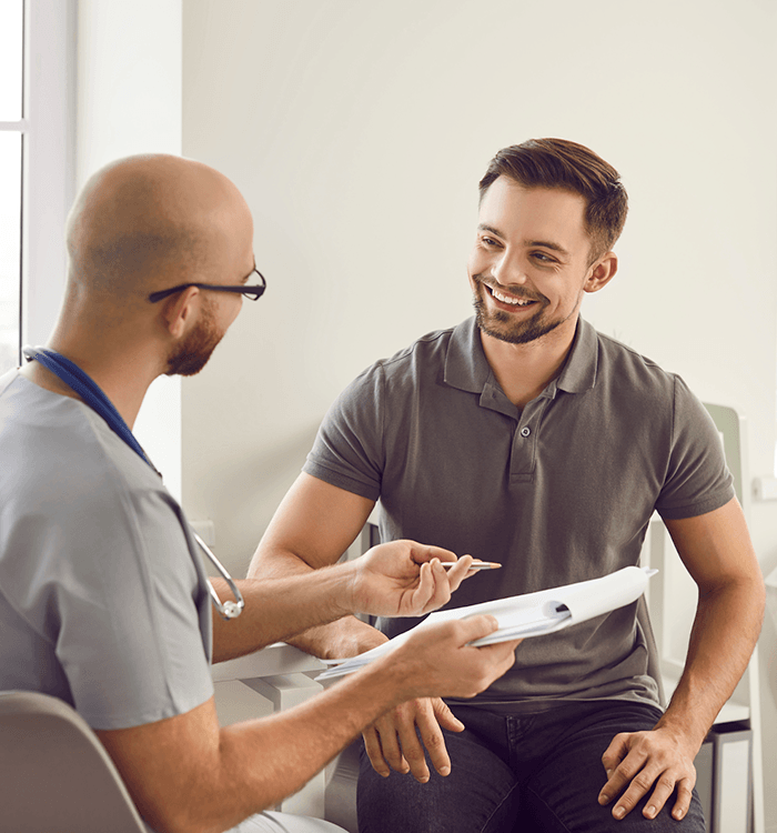 Patient and doctor talking in exam room