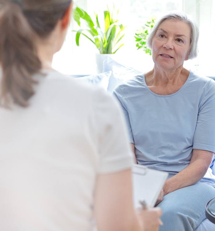 older woman talking to doctor 