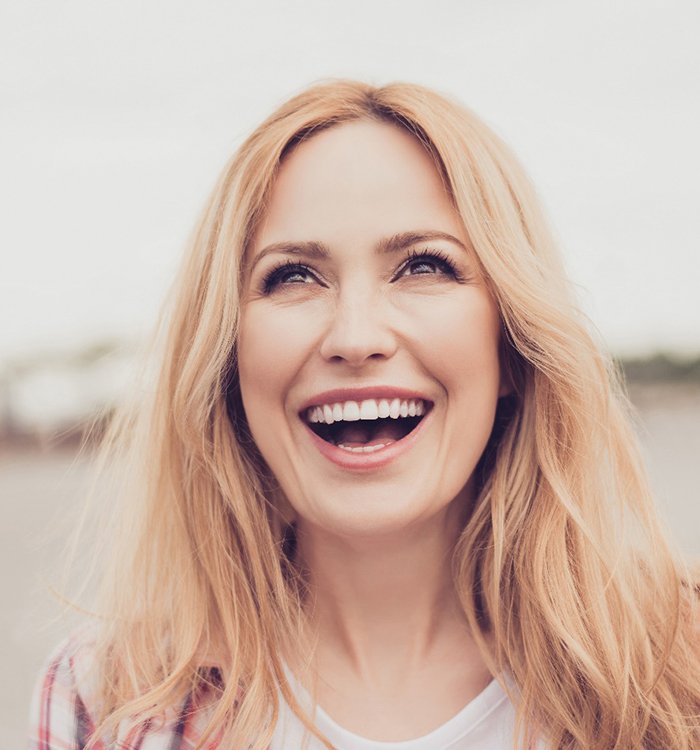 blonde woman laughing