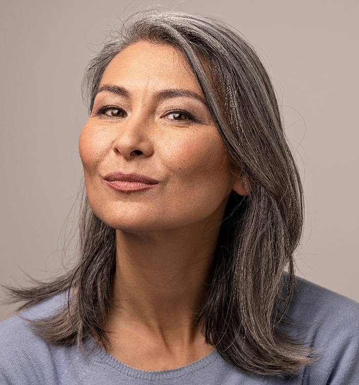 attractive older woman looking directly at camera 