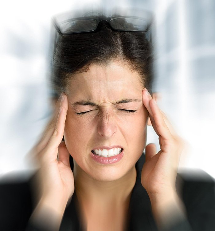 Woman experiencing aura associated with migraine